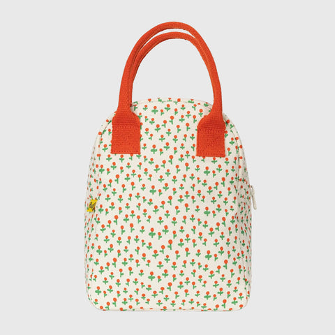 Small handbag with floral pattern and orange handles on a white background