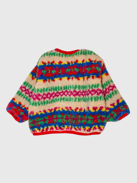 Colorful patterned sweater on a light gray background