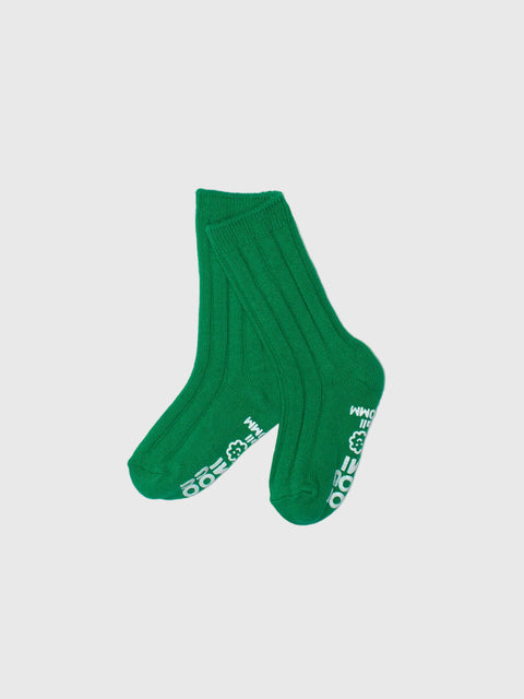 Green sock with white text on a light gray background