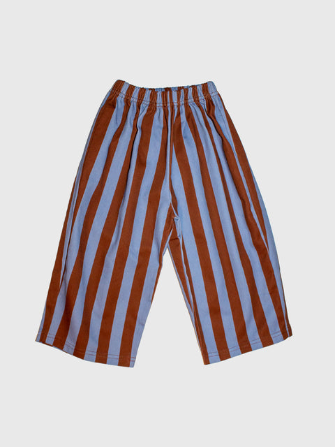 A pair of wide-leg cropped pants with vertical rust-brown and light blue stripes, featuring an elastic waistband, shown against a light gray background.