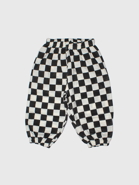 Black and white checkered pants on a light gray background